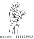 Veterinary hospital staff holding a dog 111153692