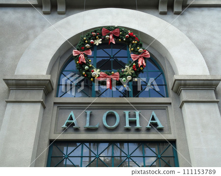 The Word Aloha and Christmas Wreath on side of Aloha Tower 111153789