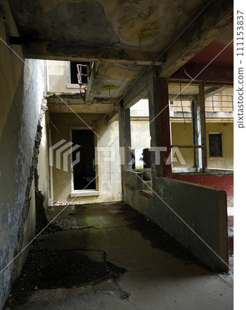 Inside a broken rundown building 111153837