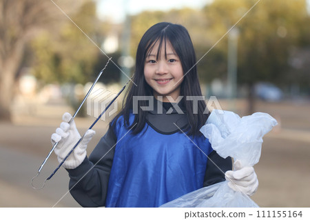 girl picking up trash girl picking up trash 111155164