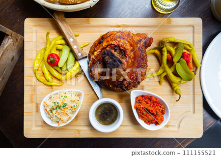 Roasted Ham Hock with coleslaw salad and spicy dip 111155521