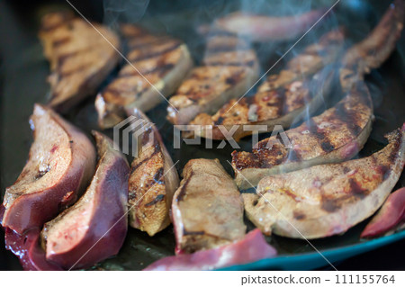 Close up of frying on grill tasty pork liver 111155764