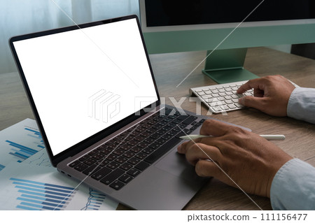 man hands and laptop with blank screen mock up Using laptop computer modern sitting at office 111156477