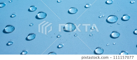 Water background with drops on a blue surface, wet pattern. Spa concept, texture of cosmetics, gel, serum. Aqua spray, banner 111157077