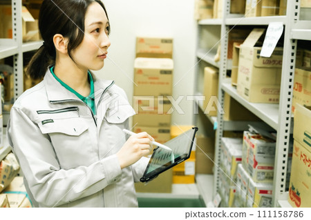 Young woman managing inventory Young woman managing inventory 111158786
