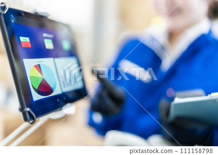 Young woman working at a distribution center, faceless 111158798