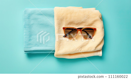 two beach towels and sunglasses. Generative AI 111160022