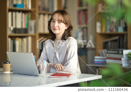 Young woman working in the office Young woman working in the office 111160436