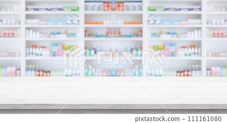 Empty white wood counter top with blur pharmacy drugstore shelves background Empty white wood counter top with blur pharmacy drugstore shelves background 111161080