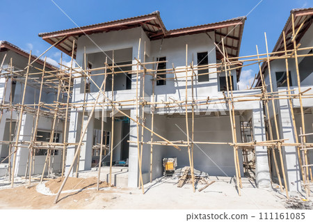 construction residential new house in progress at building site housing estate development construction residential new house in progress at building site housing estate development 111161085