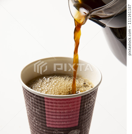 Pour coffee into a paper cup 02 Pour coffee into a paper cup 02 111161187