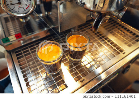 Coffee shot,Coffee machine pouring out espresso shot 111161401