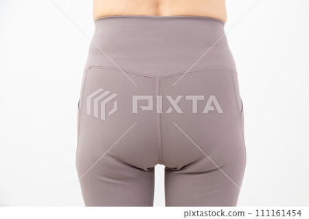 Hips of a middle-aged woman who lost weight through dieting 111161454