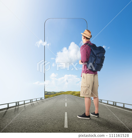 Asian man in a hat with a backpack standing on the street with a hill view on the mobile phone screen Asian man in a hat with a backpack standing on the street with a hill view on the mobile phone screen 111161528