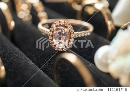 Gold jewelry diamond rings show in luxury retail store display showcase 111161746