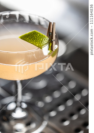 Exotic cocktail drink Daiquiri Twis on the bar counter in the pub Exotic cocktail drink Daiquiri Twis on the bar counter in the pub 111164836