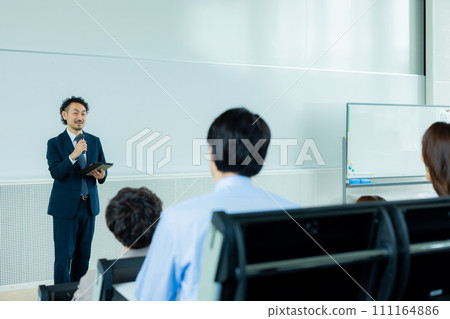Businessman speaking at a seminar Businessman speaking at a seminar 111164886