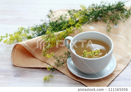 Herbal tea from herb Galium verum, also known as lady's bedstraw or yellow bedstraw Herbal tea from herb Galium verum, also known as lady's bedstraw or yellow bedstraw 111165056