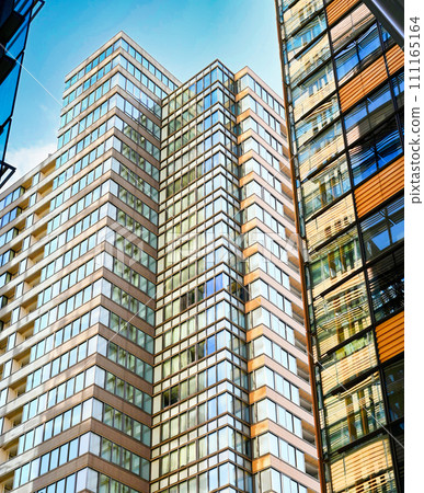Beautiful view of skyscrapers with all-glass windows Beautiful view of skyscrapers with all-glass windows 111165164
