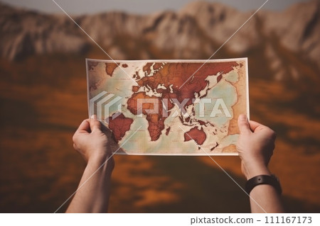 hand holding travel map, natural background, travel concept 111167173
