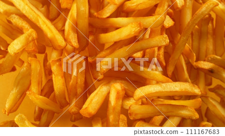 Flying French Fries up in the Air. Fast Food Concept with Flying Food. Flying French Fries up in the Air. Fast Food Concept with Flying Food. 111167683