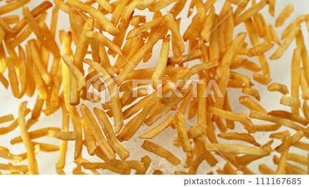 Flying French Fries up in the Air. Fast Food Concept with Flying Food. Flying French Fries up in the Air. Fast Food Concept with Flying Food. 111167685