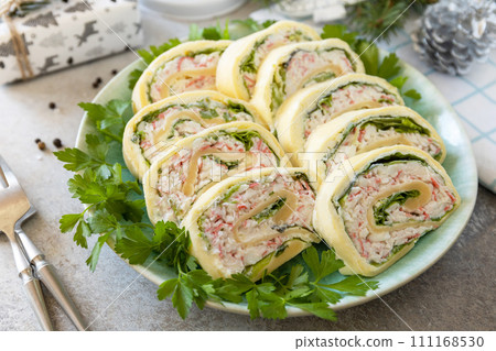 Creative appetizers christmas. Cheese roll with crab sticks, cream cheese and eggs. 111168530