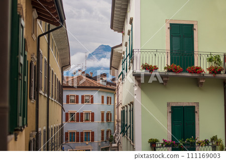 Colorful houses mountains in the city of Arco Italy 111169003