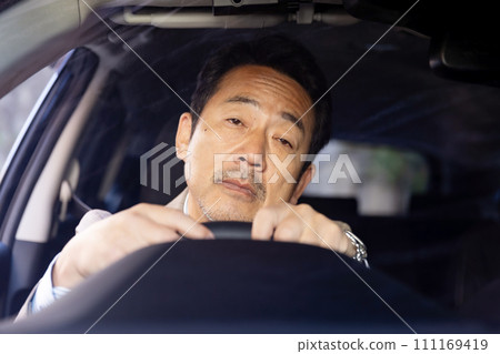 A man who falls asleep at the wheel A man who falls asleep at the wheel 111169419