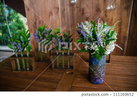 decor of flowers on a table in a restaurant decor of flowers on a table in a restaurant 111169652