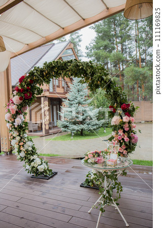 arch for a wedding ceremony of flowers decor 111169825