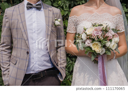 bride and groom in summer park together 111170065