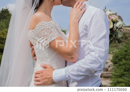 bride and groom in summer park together 111170080