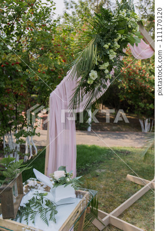 decor of arches and chairs for the wedding ceremony 111170120