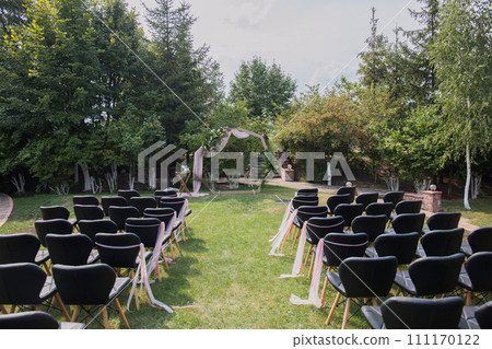 decor of arches and chairs for the wedding ceremony 111170122