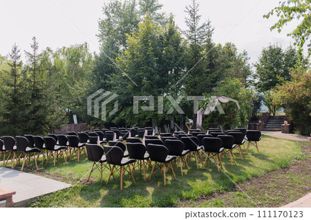 decor of arches and chairs for the wedding ceremony 111170123