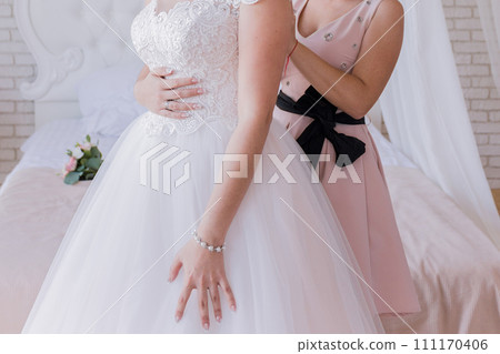 the bride wears a wedding dress 111170406