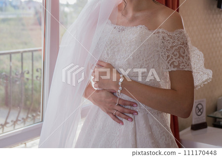 bride in peignoir in the morning in the room 111170448