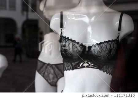 Closeup of black bra on mannequin in a fashion store showroom Closeup of black bra on mannequin in a fashion store showroom 111171310