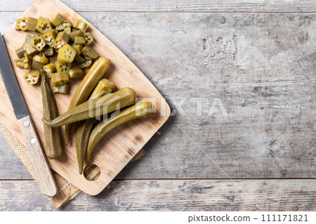 Okra slices on cutting board Okra slices on cutting board 111171821