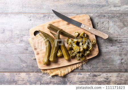 Okra slices on cutting board Okra slices on cutting board 111171823