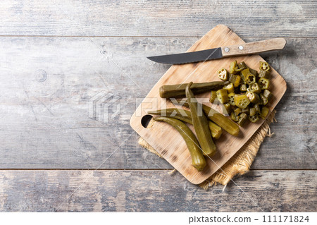 Okra slices on cutting board Okra slices on cutting board 111171824