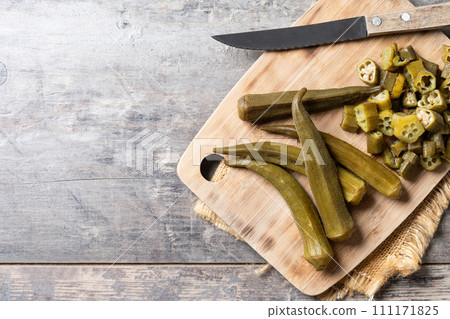 Okra slices on cutting board Okra slices on cutting board 111171825