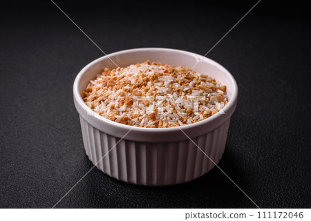 Large grains of uncooked white rice in a ceramic bowl Large grains of uncooked white rice in a ceramic bowl 111172046