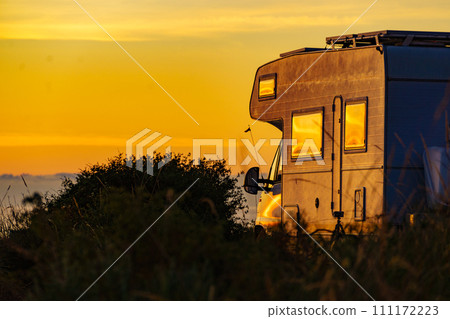 Caravan on nature in the morning at sunrise Caravan on nature in the morning at sunrise 111172223