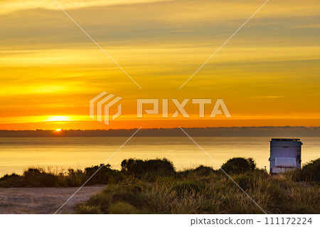 Caravan on sea at sunrise. 111172224