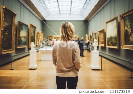 Back view of woman in Art Gallery Appreciating Artwork 111173819