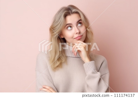 Cute girl looking at copy space touching chin hand thinking isolated pastel color background 111174137