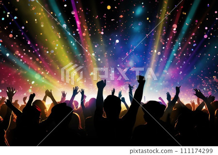 a vibrant concert crowd illuminated by colorful stage lights and surrounded by falling confetti 111174299