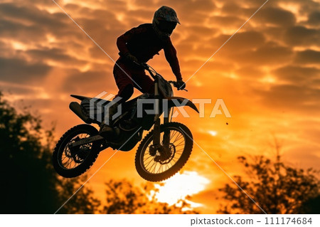 Photo of motocross jump silhouette with natural background 111174684